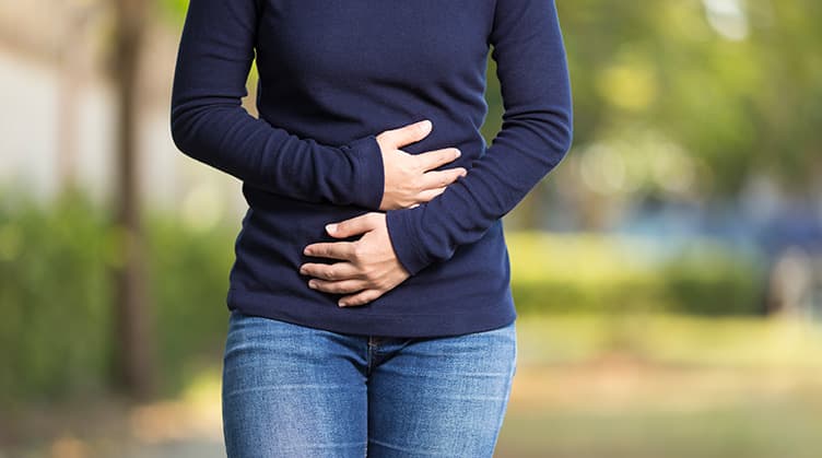 Woman holding stomach