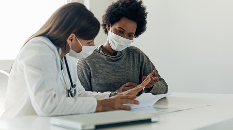 doctor and patient reviewing medical information