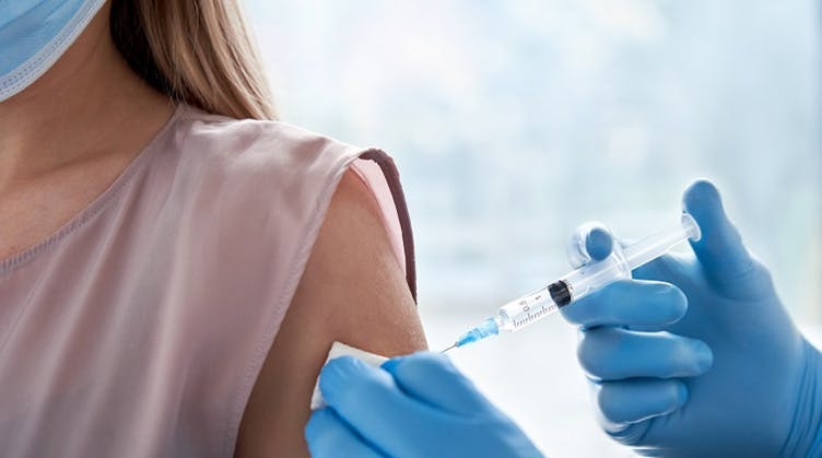 Female patient receiving vaccine