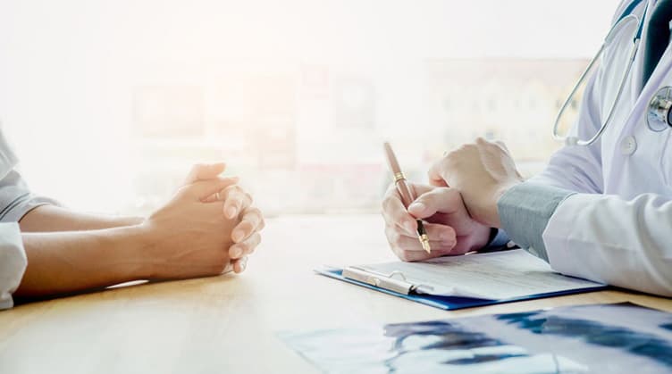 patient and health care provider discussing medical records