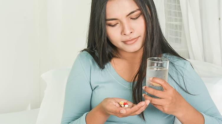 Woman taking medication