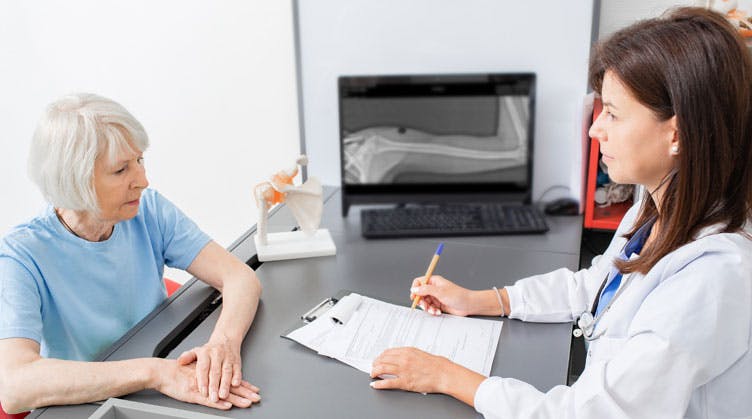 patient and rheumatology health care provider discuss visit